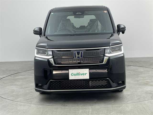 ホンダ ステップワゴン スパーダ eHEV 愛知県 2025(令7)年 0.1万km未満 黒 登録済み未使用車/ホンダセンシング/　・衝突軽減ブレーキ/　・誤発進抑制機能/　・後方誤発進抑制機能/　・近距離衝突軽減ブレーキ/　・歩行者事故低減ステアリング/　・路外越脱抑制機能/　・アダプティブクルーズコントロール/　・車線維持支援システム/　・トラフィックジャムアシスト/　・先行発進知らせ機能/　・標識認識機能/　・オートハイビーム/ホンダパーソナルアシスト/純正11.4インチHONDA　CONNECTナビ/　（Bluetooth/CD/Apple CarPlay/）/バックカメラ/ディライト/ハーフレザー/シートヒーター/本革ステアリング/シートバックテーブル/両側パワースライドドア/電動リアゲード/3列目格納シート/純正LEDライト/コーナリングライト/パドルシフト/オットマン