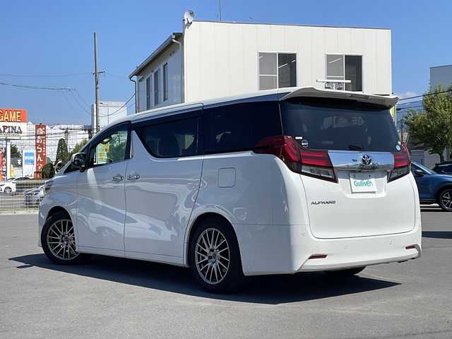 トヨタ アルファード X 山形県 2017(平29)年 10.7万km ホワイトパールクリスタルシャイン 衝突軽減ブレーキ/横滑り防止装置/ALPINE9インチナビ【X9Z】/(CD/DVD/フルセグTV/BT)/ALPINEフリップダウンモニター/バックカメラ/ビルトインETC/アダプティブクルーズコントロール/両側パワースライドドア/ドライブレコーダー/革巻きステアリング/ステアリングスイッチ/電動パーキングブレーキ/ブレーキホールド/レザー調シートカバー/電動格納ミラー/フロアマット/スマートキー×２