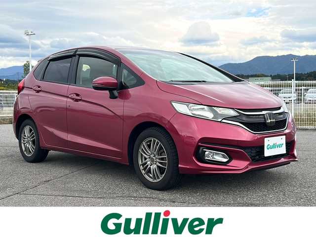 ホンダ フィット 13G F 富山県 2017(平29)年 6.5万km ルージュアメジストM 禁煙車　/純正ＨＤＤナビ　/フルセグ　/バックカメラ　/レーダークルーズコントロール　/スマートキー　/純正アルミホイール　/純正オーディオ　/ウィンカーミラー　/電動格納ミラー　/ビルトインＥＴＣ　/プッシュスタート