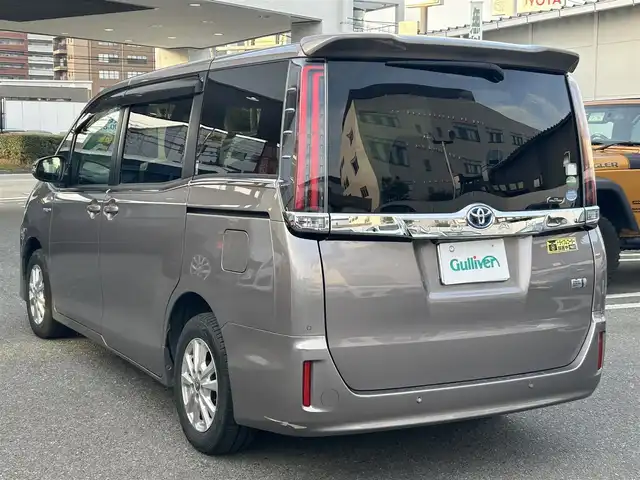 トヨタ ノア ハイブリッド G 福岡県 2020(令2)年 4.8万km アバンギャルドブロンズメタリック ワンオーナー/純正ディーラーナビ（TV/BT/DVD/AM/FM)/3列シート/パワースライドドア/クルーズコントロール/バックカメラ/コーナーセンサー（前後）/ウォークスルー/ドライブレコーダー(前後)/ビルトインETC/モード（EV/ECO/PWR）/オートエアコン（前席・後席）/TVキャンセラー/オートライト/オートハイビーム/フォグランプ/LEDヘッドライト/純正アルミホイール/純正フロアマット/シートヒーター/プッシュスタートボタン/スマートキー/盗難防止装置/横滑り防止装置/レーンキープアシスト/取扱説明書/保証書/スマートキー×１