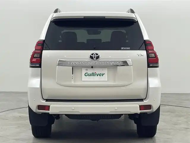トヨタ ランドクルーザー プラド TX Lパッケージ 福岡県 2023(令5)年 1.4万km ホワイトパールクリスタルシャイン サンルーフ　/純正ナビ　/バックカメラ　/ビルトインＥＴＣ　/レーダークルコン　/コーナーセンサー　/衝突軽減ブレーキ　/レーンキープ　/踏み間違い防止/先行車発進お知らせ　/ＭＴモード付き　/ベージュ本革　/シートベンチレーション／ヒーター　/ステアリングリモコン　/パワーシート　/ルーフレール