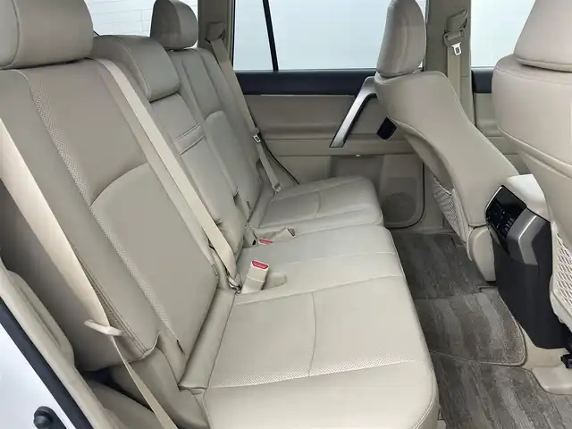 トヨタ ランドクルーザー プラド TX Lパッケージ 福岡県 2023(令5)年 1.4万km ホワイトパールクリスタルシャイン サンルーフ　/純正ナビ　/バックカメラ　/ビルトインＥＴＣ　/レーダークルコン　/コーナーセンサー　/衝突軽減ブレーキ　/レーンキープ　/踏み間違い防止/先行車発進お知らせ　/ＭＴモード付き　/ベージュ本革　/シートベンチレーション／ヒーター　/ステアリングリモコン　/パワーシート　/ルーフレール