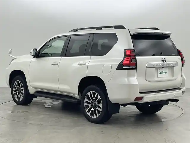 トヨタ ランドクルーザー プラド TX Lパッケージ 福岡県 2023(令5)年 1.4万km ホワイトパールクリスタルシャイン サンルーフ　/純正ナビ　/バックカメラ　/ビルトインＥＴＣ　/レーダークルコン　/コーナーセンサー　/衝突軽減ブレーキ　/レーンキープ　/踏み間違い防止/先行車発進お知らせ　/ＭＴモード付き　/ベージュ本革　/シートベンチレーション／ヒーター　/ステアリングリモコン　/パワーシート　/ルーフレール