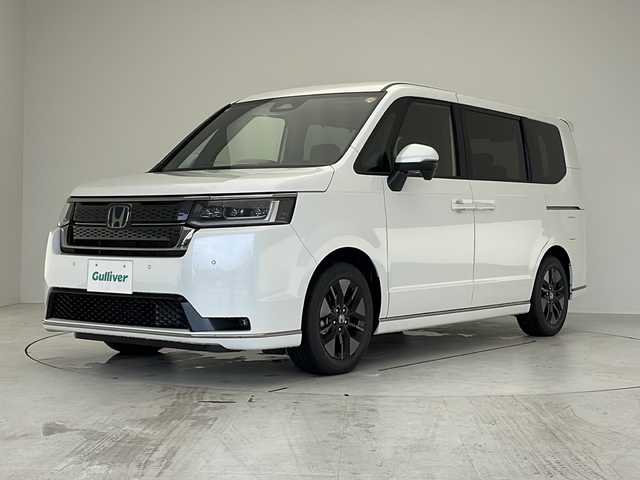 ホンダ ステップワゴン スパーダ eHEV 愛知県 2025(令7)年 0.1万km未満 プラチナホワイトパール 登録済未使用車/衝突軽減システム/純正１１．４型SDナビ/両側パワースライドドア/レーダークルーズコントロール/シートヒーター/フルセグ/CD/DVD/Bluetooth/バックカメラ/電動リアゲート/コーナーセンサー/純正アルミホイール/ブラインドスポットモニター/LEDヘッドライト/パドルシフト/オートマチックハイビーム/ステアリングスイッチ/スマートキー/プッシュスタート