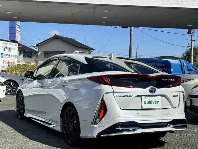 トヨタ プリウス ＰＨＶ A 熊本県 2020(令2)年 8.5万km プラチナホワイトパールマイカ ワンオーナー/モデリスタエアロ/社外ナビ（AVIC-RQ911）/【フルセグTV/Bluetooth/CD/DVD】/全方位カメラ/レーダークルーズコントロール/プリクラッシュセーフティー/レーンキープアシスト/コーナーセンサー/パーキングサポートブレーキ/ブラインドスポットモニター/オートLEDライト/オートハイビーム/社外１８インチAW（LEONIS）/【純正AW車載】/D席パワーシート/前席シートヒーター/革巻きステアリング/ステアリングスイッチ/プッシュスタート/スマートキー/ウィンカーミラー/ETC/ドライブレコーダー前後/純正フロアマット/社外ドアバイザー/充電ケーブル車載/保証書/取扱説明書/スペアキー
