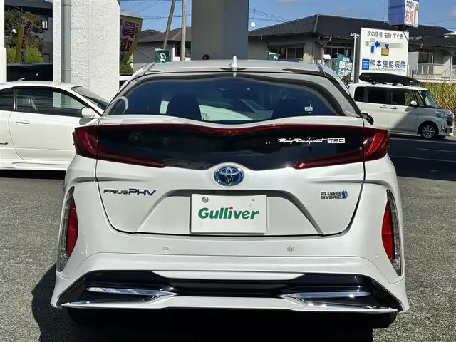 トヨタ プリウス ＰＨＶ A 熊本県 2020(令2)年 8.5万km プラチナホワイトパールマイカ ワンオーナー/モデリスタエアロ/社外ナビ（AVIC-RQ911）/【フルセグTV/Bluetooth/CD/DVD】/全方位カメラ/レーダークルーズコントロール/プリクラッシュセーフティー/レーンキープアシスト/コーナーセンサー/パーキングサポートブレーキ/ブラインドスポットモニター/オートLEDライト/オートハイビーム/社外１８インチAW（LEONIS）/【純正AW車載】/D席パワーシート/前席シートヒーター/革巻きステアリング/ステアリングスイッチ/プッシュスタート/スマートキー/ウィンカーミラー/ETC/ドライブレコーダー前後/純正フロアマット/社外ドアバイザー/充電ケーブル車載/保証書/取扱説明書/スペアキー