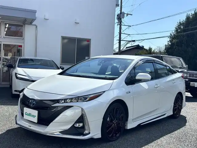 トヨタ プリウス ＰＨＶ A 熊本県 2020(令2)年 8.5万km プラチナホワイトパールマイカ ワンオーナー/モデリスタエアロ/社外ナビ（AVIC-RQ911）/【フルセグTV/Bluetooth/CD/DVD】/全方位カメラ/レーダークルーズコントロール/プリクラッシュセーフティー/レーンキープアシスト/コーナーセンサー/パーキングサポートブレーキ/ブラインドスポットモニター/オートLEDライト/オートハイビーム/社外１８インチAW（LEONIS）/【純正AW車載】/D席パワーシート/前席シートヒーター/革巻きステアリング/ステアリングスイッチ/プッシュスタート/スマートキー/ウィンカーミラー/ETC/ドライブレコーダー前後/純正フロアマット/社外ドアバイザー/充電ケーブル車載/保証書/取扱説明書/スペアキー
