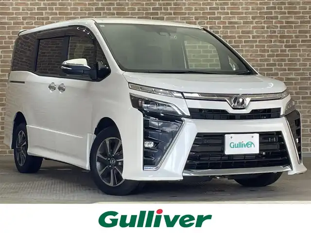 トヨタ ヴォクシー ZS 煌Ⅱ 岩手県 2019(令1)年 10.9万km ホワイトパールクリスタルシャイン ワンオーナー/４WD/両側パワースライドドア/寒冷地仕様/トヨタセーフティセンスC/プリクラッシュセーフティ/レーンディパーチャーアラート/オートマチックハイビーム/先行車発進告知機能/クルーズコントロール/クリアランスソナー/パーキングサポートブレーキ/MTモード付AT/横滑り防止装置/アイドリングストップ/リヤオートエアコン/ロールサンシェード/純正SDナビ/フルセグTV/TVキャンセラー/バックカメラ/ドライブレコーダー/ETC/エンジンスターター/LEDヘッドランプ/純正１６インチアルミホイール