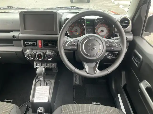 スズキ ジムニー ノマド FC 滋賀県 2025(令7)年 0.1千km 緑 登録済未使用車/車検10年10月まで/スズキセーフティーサポート/AT車/4WD/純正フロアマット/純正LEDヘッドライト/シートヒーター/取説/保証書/スペアキー