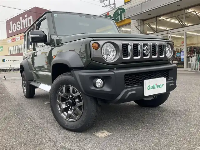 スズキ ジムニー ノマド FC 滋賀県 2025(令7)年 0.1千km 緑 登録済未使用車/車検10年10月まで/スズキセーフティーサポート/AT車/4WD/純正フロアマット/純正LEDヘッドライト/シートヒーター/取説/保証書/スペアキー