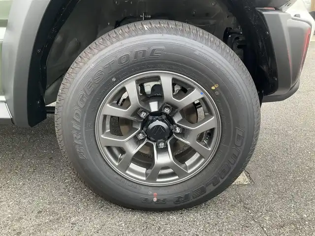 スズキ ジムニー ノマド FC 滋賀県 2025(令7)年 0.1千km 緑 登録済未使用車/車検10年10月まで/スズキセーフティーサポート/AT車/4WD/純正フロアマット/純正LEDヘッドライト/シートヒーター/取説/保証書/スペアキー