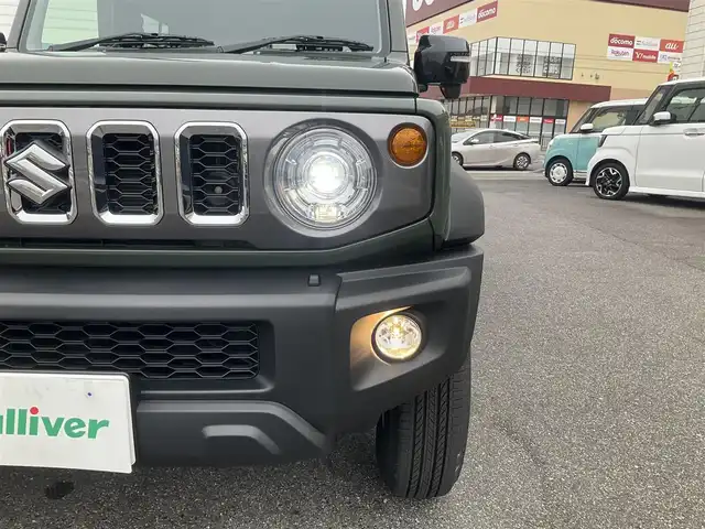 スズキ ジムニー ノマド FC 滋賀県 2025(令7)年 0.1千km 緑 登録済未使用車/車検10年10月まで/スズキセーフティーサポート/AT車/4WD/純正フロアマット/純正LEDヘッドライト/シートヒーター/取説/保証書/スペアキー