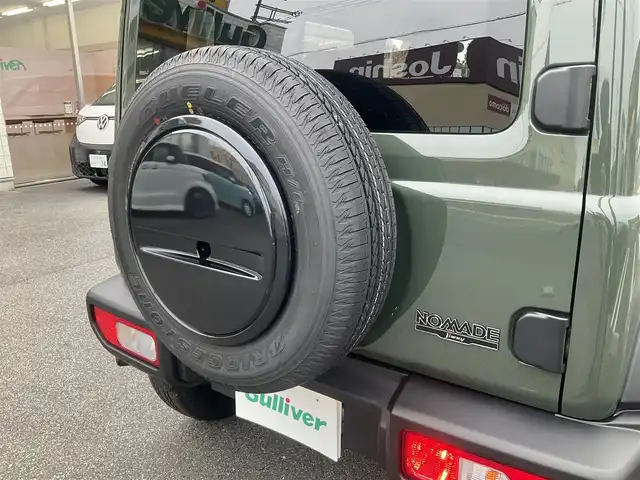 スズキ ジムニー ノマド FC 滋賀県 2025(令7)年 0.1千km 緑 登録済未使用車/車検10年10月まで/スズキセーフティーサポート/AT車/4WD/純正フロアマット/純正LEDヘッドライト/シートヒーター/取説/保証書/スペアキー