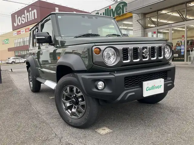 スズキ ジムニー ノマド FC 滋賀県 2025(令7)年 0.1千km 緑 登録済未使用車/車検10年10月まで/スズキセーフティーサポート/AT車/4WD/純正フロアマット/純正LEDヘッドライト/シートヒーター/取説/保証書/スペアキー