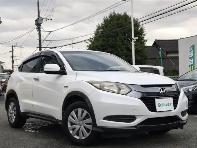 ホンダ ヴェゼル ハイブリッド 熊本県 2014(平26)年 9.7万km ホワイトオーキッドパール 純正ナビ/【フルセグTV/Bluetooth/CD/DVD】/バックカメラ/クルーズコントロール/プッシュスタート/スマートキー/ウィンカーミラー/ブレーキホールド/ステアリングスイッチ/ドライブレコーダー/ビルトインETC/横滑り防止装置/ABS/盗難防止装置/保証書/スペアキー