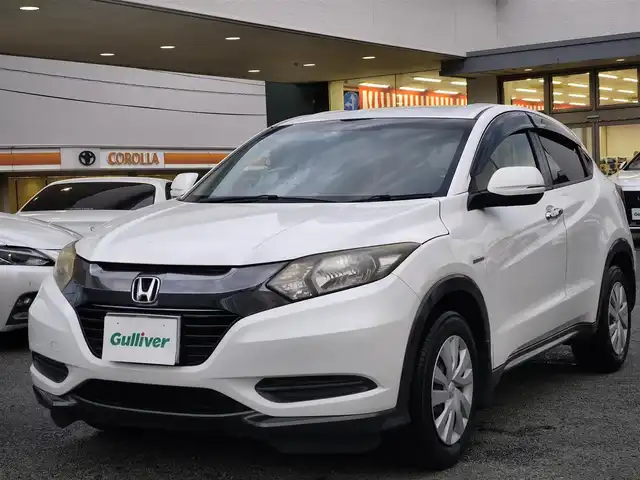 ホンダ ヴェゼル ハイブリッド 熊本県 2014(平26)年 9.7万km ホワイトオーキッドパール 純正ナビ/【フルセグTV/Bluetooth/CD/DVD】/バックカメラ/クルーズコントロール/プッシュスタート/スマートキー/ウィンカーミラー/ブレーキホールド/ステアリングスイッチ/ドライブレコーダー/ビルトインETC/横滑り防止装置/ABS/盗難防止装置/保証書/スペアキー