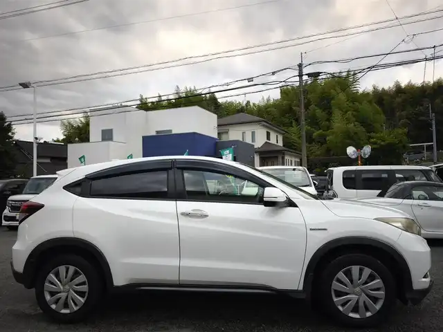 ホンダ ヴェゼル ハイブリッド 熊本県 2014(平26)年 9.7万km ホワイトオーキッドパール 純正ナビ/【フルセグTV/Bluetooth/CD/DVD】/バックカメラ/クルーズコントロール/プッシュスタート/スマートキー/ウィンカーミラー/ブレーキホールド/ステアリングスイッチ/ドライブレコーダー/ビルトインETC/横滑り防止装置/ABS/盗難防止装置/保証書/スペアキー
