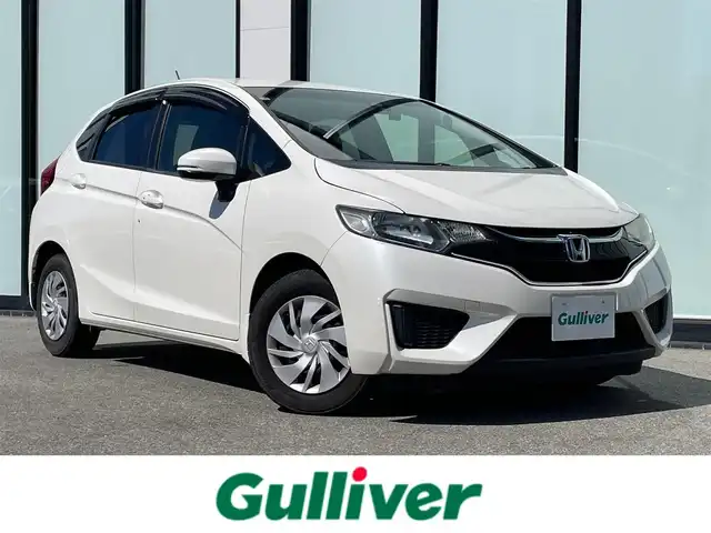 ホンダ フィット 13G Fパッケージ 大阪府 2015(平27)年 6.7万km プレミアムホワイトパールⅡ 純正ナビ　/   フルセグTV/CD/DVD/Bluetooth　/バックモニター/衝突軽減ブレーキ　/リアコーナーセンサー/横滑り防止装置　/アイドリングストップ　/ステアリングスイッチ　/前後ドライブレコーダー　/純正フロアマット　/プッシュスタート　/スマートキー　　/ＥＴＣ