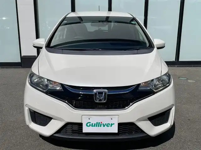 ホンダ フィット 13G Fパッケージ 大阪府 2015(平27)年 6.7万km プレミアムホワイトパールⅡ 純正ナビ　/   フルセグTV/CD/DVD/Bluetooth　/バックモニター/衝突軽減ブレーキ　/リアコーナーセンサー/横滑り防止装置　/アイドリングストップ　/ステアリングスイッチ　/前後ドライブレコーダー　/純正フロアマット　/プッシュスタート　/スマートキー　　/ＥＴＣ