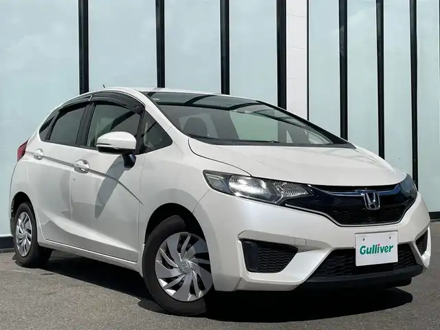ホンダ フィット 13G Fパッケージ 大阪府 2015(平27)年 6.7万km プレミアムホワイトパールⅡ 純正ナビ　/   フルセグTV/CD/DVD/Bluetooth　/バックモニター/衝突軽減ブレーキ　/リアコーナーセンサー/横滑り防止装置　/アイドリングストップ　/ステアリングスイッチ　/前後ドライブレコーダー　/純正フロアマット　/プッシュスタート　/スマートキー　　/ＥＴＣ