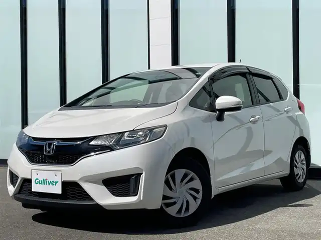 ホンダ フィット 13G Fパッケージ 大阪府 2015(平27)年 6.7万km プレミアムホワイトパールⅡ 純正ナビ　/   フルセグTV/CD/DVD/Bluetooth　/バックモニター/衝突軽減ブレーキ　/リアコーナーセンサー/横滑り防止装置　/アイドリングストップ　/ステアリングスイッチ　/前後ドライブレコーダー　/純正フロアマット　/プッシュスタート　/スマートキー　　/ＥＴＣ