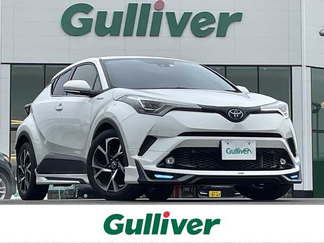 トヨタ Ｃ－ＨＲ G 佐賀県 2018(平30)年 9.6万km ホワイトパールクリスタルシャイン 社外SDナビ(フルセグTV/CD/DVD/BT)/モデリスタエアロ(F/S/R)/バックモニター/トヨタセーフティー/クリアランスソナー/シートヒーター/ミラーヒーター/BSM/ETC/オートホールド/純正フロアマット/純正18インチアルミホイール/純正LEDヘッドライト