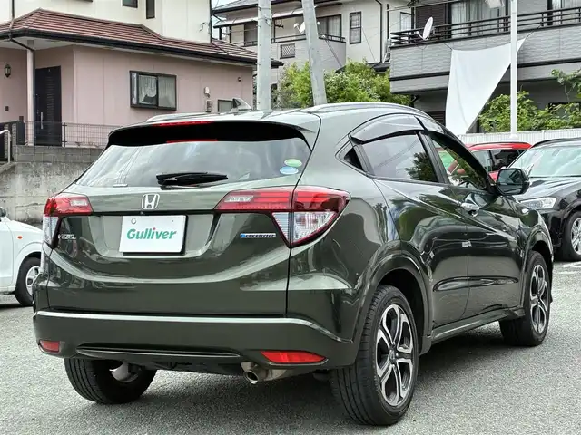 ホンダ ヴェゼル ハイブリッド Z 熊本県 2015(平27)年 11.2万km ミスティックグリーンパール ルーフレール/純正SDナビ(VXM-152VFi)/【フルセグTV/SD/CD/DVD/Bluetooth】/バックカメラ/クルーズコントロール/車両接近通報装置/ハーフレザーシート/前席シートヒーター/パドルシフト/オートLEDライト/ビルトインETC/ドライブレコーダー/横滑り防止装置/盗難防止装置/純正フロアマット/カーテンエアバッグ/プッシュスタート/スマートキー/スペアキー/取扱説明/保証書