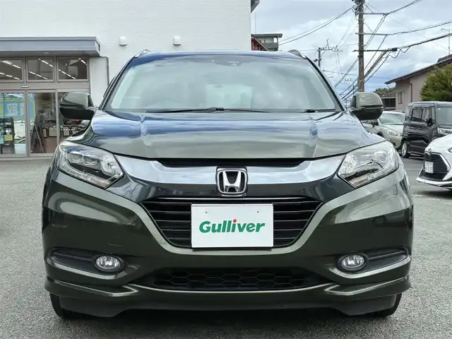 ホンダ ヴェゼル ハイブリッド Z 熊本県 2015(平27)年 11.2万km ミスティックグリーンパール ルーフレール/純正SDナビ(VXM-152VFi)/【フルセグTV/SD/CD/DVD/Bluetooth】/バックカメラ/クルーズコントロール/車両接近通報装置/ハーフレザーシート/前席シートヒーター/パドルシフト/オートLEDライト/ビルトインETC/ドライブレコーダー/横滑り防止装置/盗難防止装置/純正フロアマット/カーテンエアバッグ/プッシュスタート/スマートキー/スペアキー/取扱説明/保証書