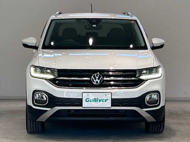 フォルクスワーゲン ＶＷ Ｔ－クロス TSI アクティブ 宮城県 2023(令5)年 1.9万km 白 アダプティブ・クルーズ・コントロール/リヤクロストラフィックアラート/ブラインドスポットモニター/レーンアシスト/純正ナビ/（Discover Pro）/・バックカメラ/・Bluetooth/USB/Apple Carplay/AndroidAuto/・純正ビルトインETC2.0/前後コーナーセンサー/MTモード付きAT/ルーフレール/プッシュスタート/スマートキー/・スペアキー/アイドリングストップ/純正LEDヘッドライト/・オートライト/・フォグランプ/純正アルミホイール/純正フロアマット