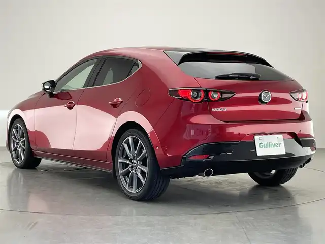 マツダ マツダ３ファストバック XD Lパッケージ 愛知県 2019(令1)年 3.7万km ソウルレッドクリスタルM 純正８．８型ナビ　ＨＤＭＩ　黒革　全方位カメラ　禁煙車　ＢＳＭ　フルセグＴＶ　前後ドラレコ　ＥＴＣ　シートヒーター　衝突軽減　追従クルコン　社外アルミ付スタッドレス４本積込　ＬＥＤオートライト　フォグ