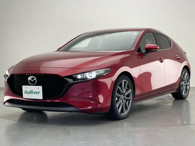 マツダ マツダ３ファストバック XD Lパッケージ 愛知県 2019(令1)年 3.7万km ソウルレッドクリスタルM 純正８．８型ナビ　ＨＤＭＩ　黒革　全方位カメラ　禁煙車　ＢＳＭ　フルセグＴＶ　前後ドラレコ　ＥＴＣ　シートヒーター　衝突軽減　追従クルコン　社外アルミ付スタッドレス４本積込　ＬＥＤオートライト　フォグ