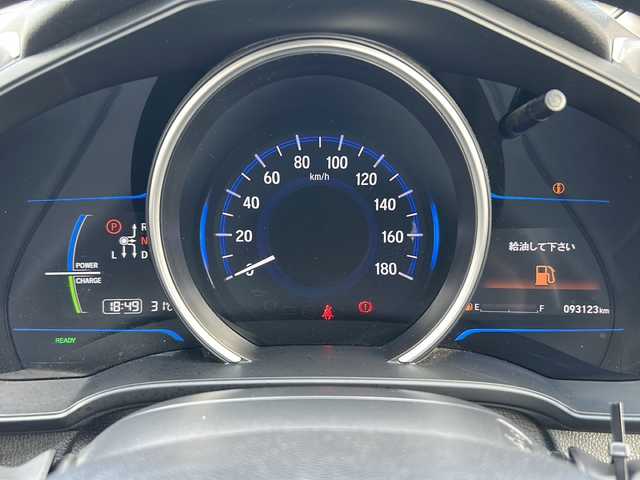 ホンダ フィット ハイブリット 石川県 2016(平28)年 9.4万km ブリリアントスポーティブルーメタリック2トーン 4WD/純正メモリナビゲーション/【CD・DVD・Bluetooth・フルセグTV・SD】/型番：VXM-174VFXi/バックカメラ/ステアリングスイッチ/ETC/プッシュスタート/・スマートキー/ハロゲンライト/・オートライト/純正フロアマット/ドアバイザー