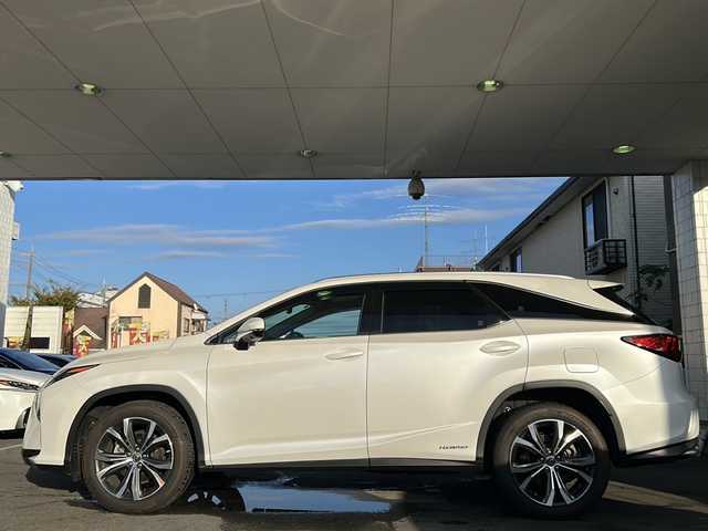 レクサス ＲＸ 450hL 京都府 2019(令1)年 7万km ソニッククォーツ 12.3インチディスプレイナビ/リアエンターテイメントシステム/マークレビンソンサウンド/サンルーフ/ヘッドアップディスプレイ/DVD・BD視聴可能/走行中視聴可能/バックカメラ/Bluetooth/ワイヤレス充電/ビルトインETC2.0/スポーツモード付/3眼LEDヘッドライト/レクサスセーフティーセンス/レーンキープアシスト/ブラインドスポットモニター/オートマチックハイビーム/ダウンヒルアシストコントロール/クルーズコントロール/メモリーパワーシート/シートヒーター＆ベンチレーション/電動格納サードシート/禁煙車/nanoe/フォグランプ/電動格納ウィンカーミラー/アイドリングストップ