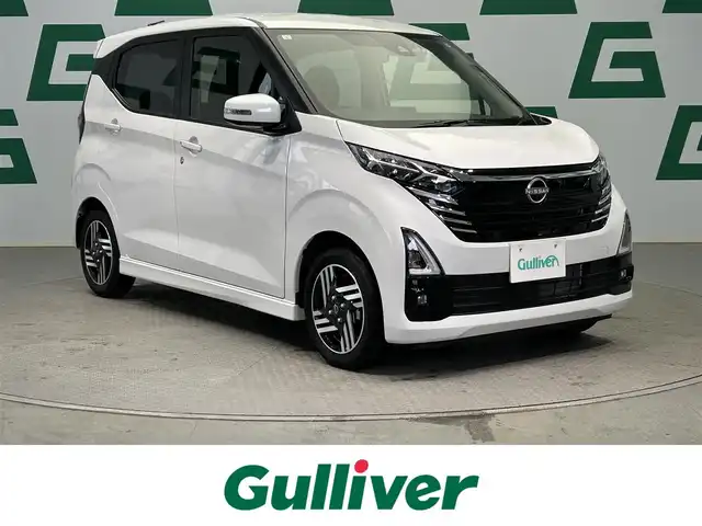 日産 デイズ ハイウェイスターX 鹿児島県 2024(令6)年 0.6万km ホワイトパール 社外7インチSDナビ（MDV-D310）/（AM/FM/CD/DVD/Bluetooth）/アラウンドビューモニター/エマージェンシーブレーキ/レーンキープアシスト/ロードサインアシスト/ETC/前方ドライブレコーダー/社外フロアマット/前後コーナーセンサー/革巻きステアリング/アイドリングストップ/ヘッドライトレベライザー