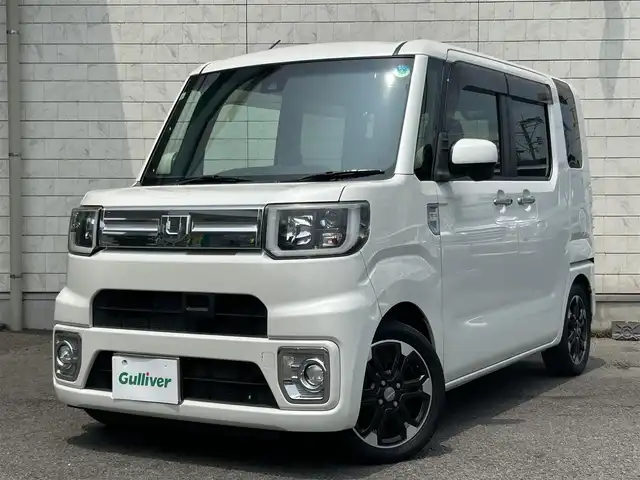 ダイハツ ウェイク G ターボ　レジャーエディション SA Ⅱ 大分県 2017(平29)年 7.6万km パールホワイトⅢ 純正SDナビゲーション(NSZN-X67D)/【フルセグTV/Bluetooth/DVD/CD/SD/ラジオ】/純正後席用モニター/外部端子接続：USB/HDMI/両側パワースライドドア/LEDヘッドライト/フロントフォグランプ/バックカメラ/ETC/スマートアシストII/・衝突警報機能	/・衝突回避支援ブレーキ機能/・車線逸脱警報機能/・誤発進抑制機能(前後)/・先行車発進お知らせ機能	/ステアリングスイッチ/純正15インチアルミホイール/純正フロアマット/純正ドアバイザー/スマートキー2本/保証書/取扱説明書