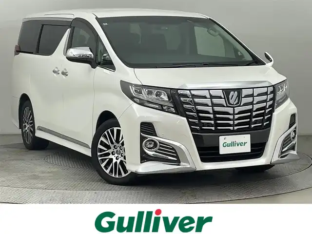 トヨタ アルファード S Cパッケージ 道央・札幌 2016(平28)年 6.8万km ホワイトパールクリスタルシャイン ・４WD/・アルパインナビ/　CD／DVD／Bluetooth／フルセグ/・バックカメラ/・アルパインフリップダウンモニター/・純正FSRガーニッシュ/・両側パワースライドドア/・純正ビルトインETC/・社外ドライブレコーダー（CSD-500FHR）/・クリアランスソナー/・横滑り防止装置/・アイドリングストップ/・電動パーキングブレーキ/・ブレーキホールド/・ステアリングヒーター/・電動リアゲート/・ハーフレザーシート/・パワーシート/・純正AW18インチ/・純正フロアマット/・LEDヘッドライト/・フォグライト/・スマートキー/・プッシュスタート