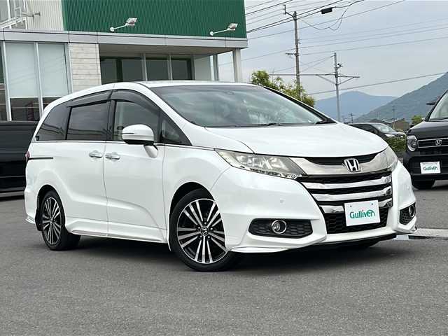 ホンダ オデッセイ 香川県 2015(平27)年 8.6万km ホワイトオーキッドパール 純正ナビゲーション/フルセグＴＶ/バックカメラ/両側パワースライドドア/リアフリップダウンモニター/レーダークルーズ/パワーシート/コーナーセンサー/LEDライト/パドルシフト