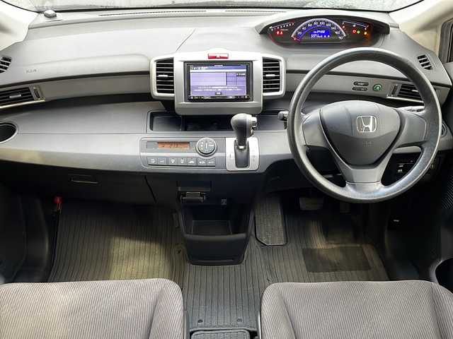 ホンダ フリード G ジャストセレクション 静岡県 2012(平24)年 7.5万km プレミアムブラキッシュパール 【主要装備】/社外ナビ　/片側パワースライドドア　/ＥＴＣ　/アルパイン後席フリップダウンモニター　/ナビ連動ドライブレコーダー　/横滑り防止機能　/Ｂｌｕｅｔｏｏｔｈ　/フルセグテレビ　/バックカメラ