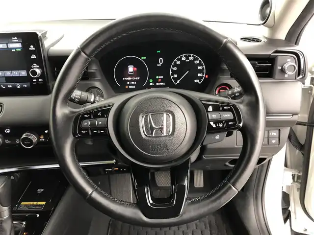 ホンダ ヴェゼル ハイブリッド e:HEV Z 愛知県 2023(令5)年 6万km プラチナホワイトパール ディスプレイオーディオ　/バックカメラ　/ハーフレザー　/シートヒーター　/ＥＴＣ２．０　/パドルシフト　/パワーバックドア　/ステアヒーター　/ＢＳＭ　/電子パーキング　/ＵＳＢ　/保証書　/取説　/記録簿　/スペアキー