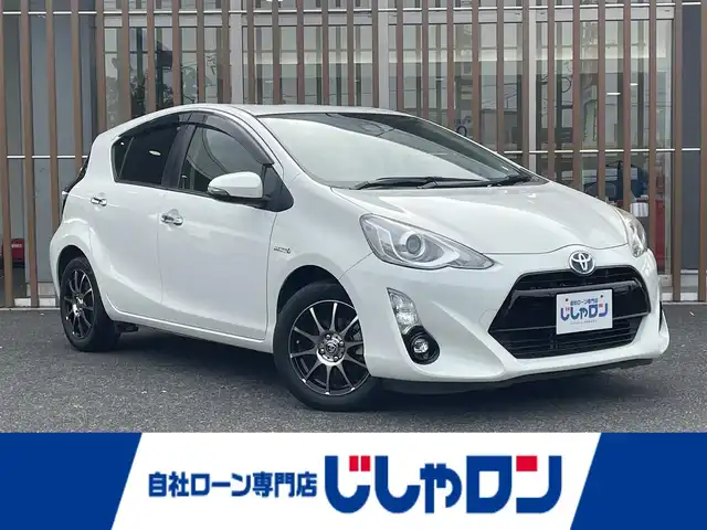 トヨタ アクア 鳥取県 2016(平28)年 10.6万km ライムホワイトパールクリスタルシャイン (株)IDOMが運営する【じしゃロン鳥取店】の自社ローン専用車両になります。こちらは現金またはオートローンご利用時の価格です。自社ローンご希望の方は別途その旨お申付け下さい/社外ナビ/・フルセグTV/・AM/FM/・CD/DVD/・Bluetooth接続/バックカメラ/トヨタセーフティセンスC/衝突被害軽減ブレーキ/オートマチックハイビーム/LDA/LEDオートライト/ETC/スマートキー/プッシュスタート