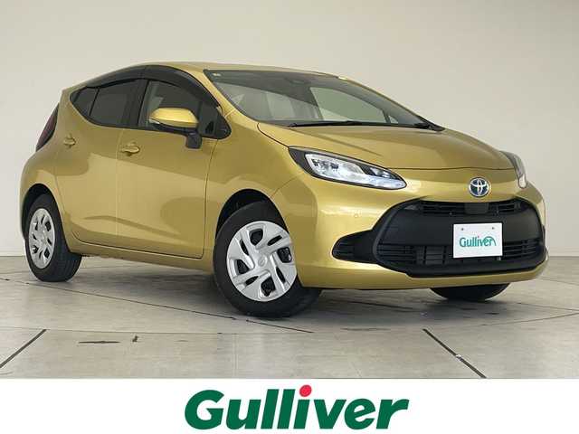 トヨタ アクア X 愛知県 2025(令7)年 0.3万km ブラスゴールドメタリック 純正ディズプレイオーディオ　ナビ機能なし/レーダークルーズコントロール/バックカメラ/コーナーセンサー/LEDヘッドライト/オートマチックハイビーム/ETC/衝突軽減システム/Bluetooth/ステアリングスイッチ/スマートキー/プッシュスタート