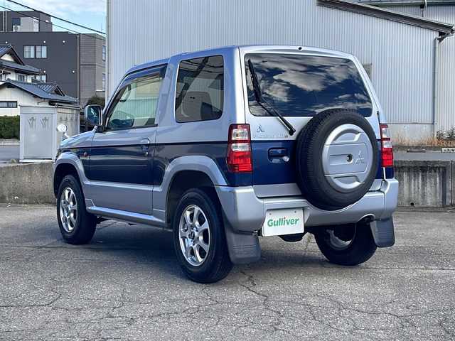 三菱 パジェロ ミニ VR 福井県 2010(平22)年 2.6万km クールシルバーM/ネアーズブルー 登録時走行距離25389ｋｍ/４WD/ターボ/ドライブレコーダー/背面タイヤ/社外15インチアルミホイール/キーレスキー/純正オーディオ/ライトレベライザー/ドアバイザー/電動格納ミラー/保証書/取扱説明書