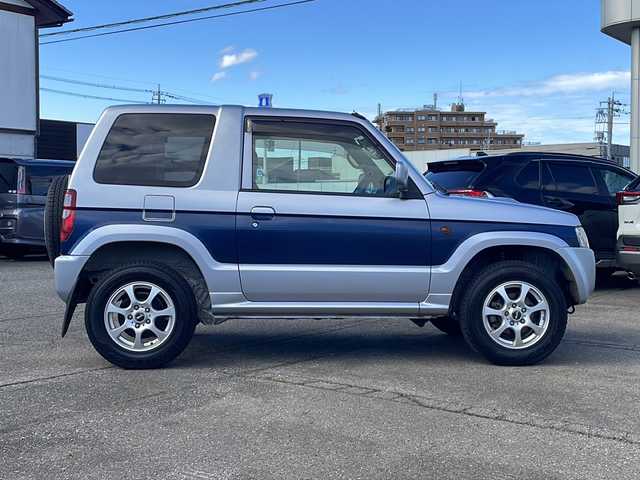 三菱 パジェロ ミニ VR 福井県 2010(平22)年 2.6万km クールシルバーM/ネアーズブルー 登録時走行距離25389ｋｍ/４WD/ターボ/ドライブレコーダー/背面タイヤ/社外15インチアルミホイール/キーレスキー/純正オーディオ/ライトレベライザー/ドアバイザー/電動格納ミラー/保証書/取扱説明書