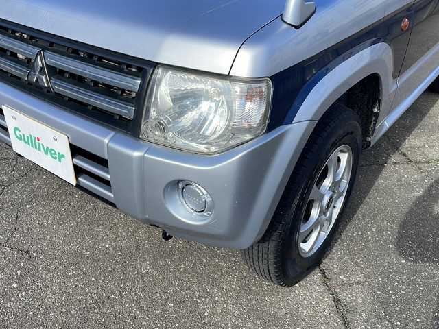 三菱 パジェロ ミニ VR 福井県 2010(平22)年 2.6万km クールシルバーM/ネアーズブルー 登録時走行距離25389ｋｍ/４WD/ターボ/ドライブレコーダー/背面タイヤ/社外15インチアルミホイール/キーレスキー/純正オーディオ/ライトレベライザー/ドアバイザー/電動格納ミラー/保証書/取扱説明書