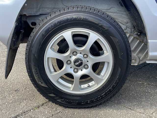 三菱 パジェロ ミニ VR 福井県 2010(平22)年 2.6万km クールシルバーM/ネアーズブルー 登録時走行距離25389ｋｍ/４WD/ターボ/ドライブレコーダー/背面タイヤ/社外15インチアルミホイール/キーレスキー/純正オーディオ/ライトレベライザー/ドアバイザー/電動格納ミラー/保証書/取扱説明書