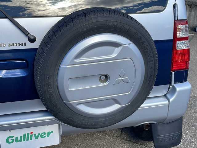 三菱 パジェロ ミニ VR 福井県 2010(平22)年 2.6万km クールシルバーM/ネアーズブルー 登録時走行距離25389ｋｍ/４WD/ターボ/ドライブレコーダー/背面タイヤ/社外15インチアルミホイール/キーレスキー/純正オーディオ/ライトレベライザー/ドアバイザー/電動格納ミラー/保証書/取扱説明書