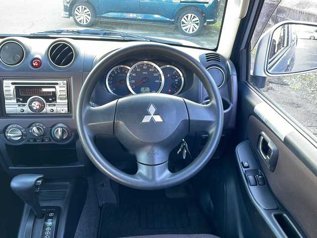 三菱 パジェロ ミニ VR 福井県 2010(平22)年 2.6万km クールシルバーM/ネアーズブルー 登録時走行距離25389ｋｍ/４WD/ターボ/ドライブレコーダー/背面タイヤ/社外15インチアルミホイール/キーレスキー/純正オーディオ/ライトレベライザー/ドアバイザー/電動格納ミラー/保証書/取扱説明書