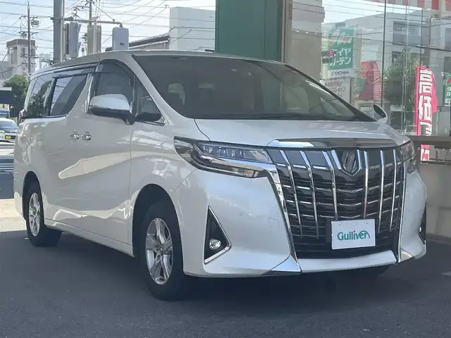 トヨタ アルファードハイブリット X 愛知県 2022(令4)年 4.6万km ホワイトパールクリスタルシャイン ワンオーナー/４WD/両側パワースライドドア/純正9型ディスプレイナビ/・Bluetooth／地デジTV／Miracast/バックカメラ/デジタルインナーミラー〈MOP〉/Toyota Safety Sense/・プリクラッシュセーフティ/・レーントレーシングアシスト/・オートマチックハイビーム/・ロードサインアシスト/・レーダークルーズコントロール（全車速追従機能付）/・先行車発進告知機能/ブラインドスポットモニター〈MOP〉/クリアランスソナー/LEDヘッドライト/社外キルティング調シートカバー/前後ドライブレコーダー（DC-DR652）/純正16インチAW〈スペアタイヤ有〉