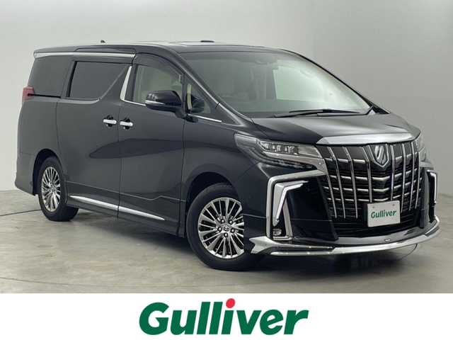 トヨタ アルファードハイブリット エグゼクティブ ラウンジ S 福岡県 2023(令5)年 1.9万km ブラック ツインムーンルーフ　/モデリスタエアロ　/１２．１インチリアエンターテインメントシステム　/純正１０．５型ＤＡナビ/フルセグTV　/全方位カメラ　/ＪＢＬプレミアムサウンド　/デジタルルームミラー　/ビルトインETC２．０　/前後ドライブレコーダー　/トヨタセーフティセンス/・コーナーセンサー/・レーダークルーズコントロール　/・衝突軽減ブレーキ/・レーンキープ/・ブラインドスポットモニター/アクセル踏み間違い防止　/パーキングアシスト　/両側電動スライドドア　/シートメモリー付きパワーシート　/シートベンチレーション/ヒーター　/ステアリングヒーター　/パワーバックドア　/３眼ＬＥＤヘッドライト　/純正１７インチアルミホイール