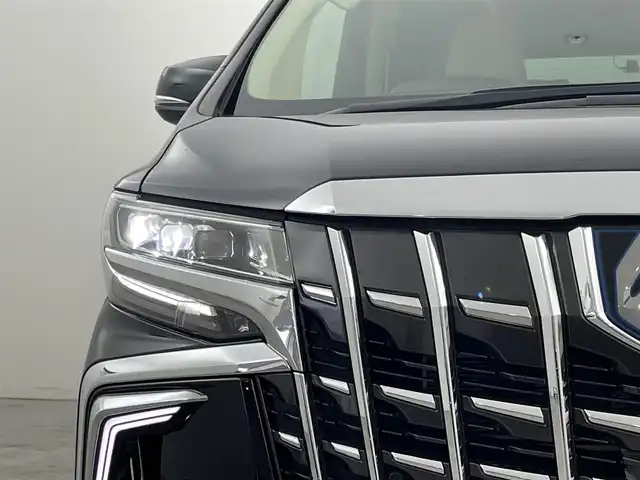 トヨタ アルファードハイブリット エグゼクティブ ラウンジ S 福岡県 2023(令5)年 1.9万km ブラック ツインムーンルーフ　/モデリスタエアロ　/１２．１インチリアエンターテインメントシステム　/純正１０．５型ＤＡナビ/フルセグTV　/全方位カメラ　/ＪＢＬプレミアムサウンド　/デジタルルームミラー　/ビルトインETC２．０　/前後ドライブレコーダー　/トヨタセーフティセンス/・コーナーセンサー/・レーダークルーズコントロール　/・衝突軽減ブレーキ/・レーンキープ/・ブラインドスポットモニター/アクセル踏み間違い防止　/パーキングアシスト　/両側電動スライドドア　/シートメモリー付きパワーシート　/シートベンチレーション/ヒーター　/ステアリングヒーター　/パワーバックドア　/３眼ＬＥＤヘッドライト　/純正１７インチアルミホイール